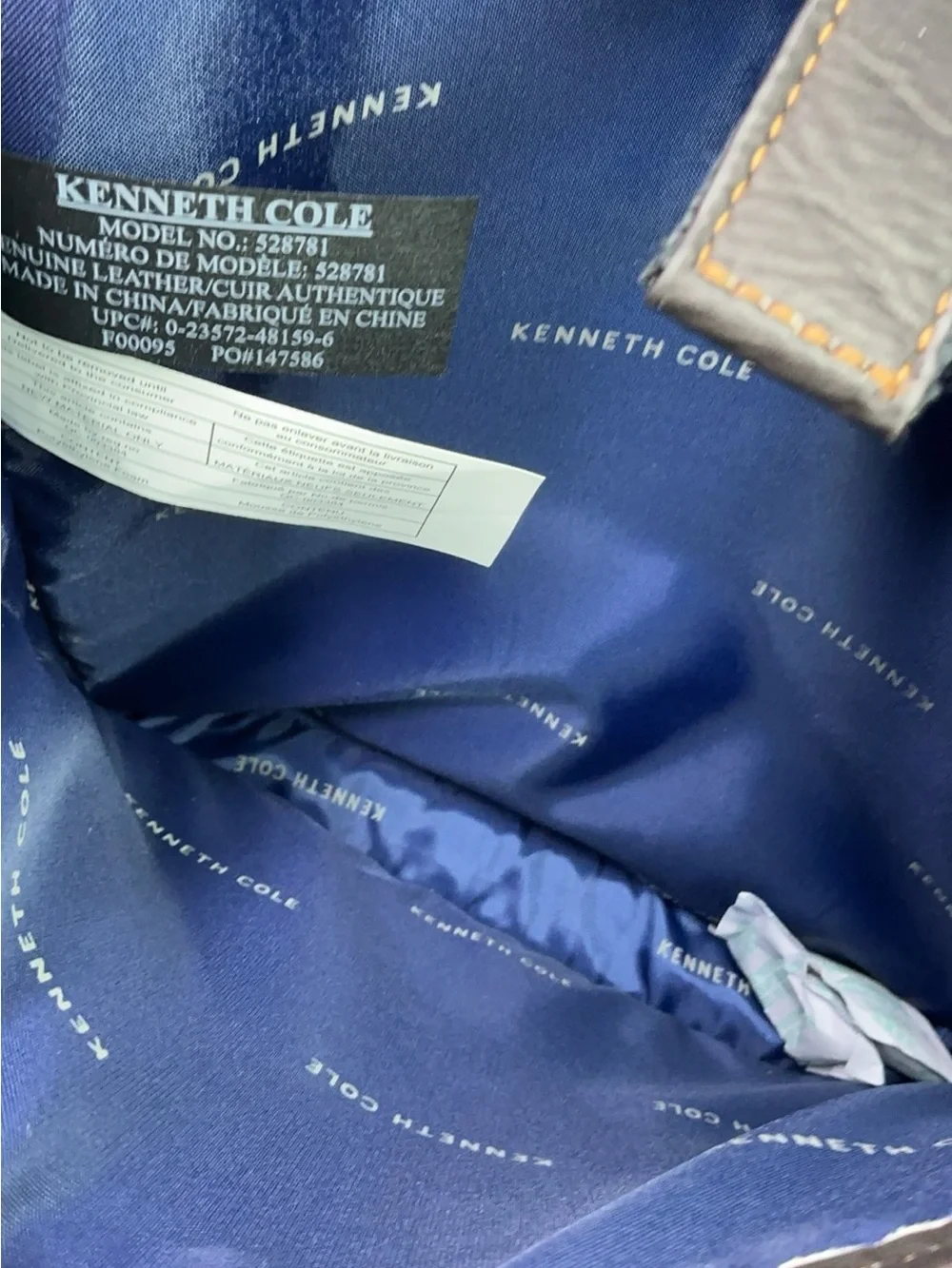 Kenneth Cole Reaction dark brown leather messenger-style tablet bag.